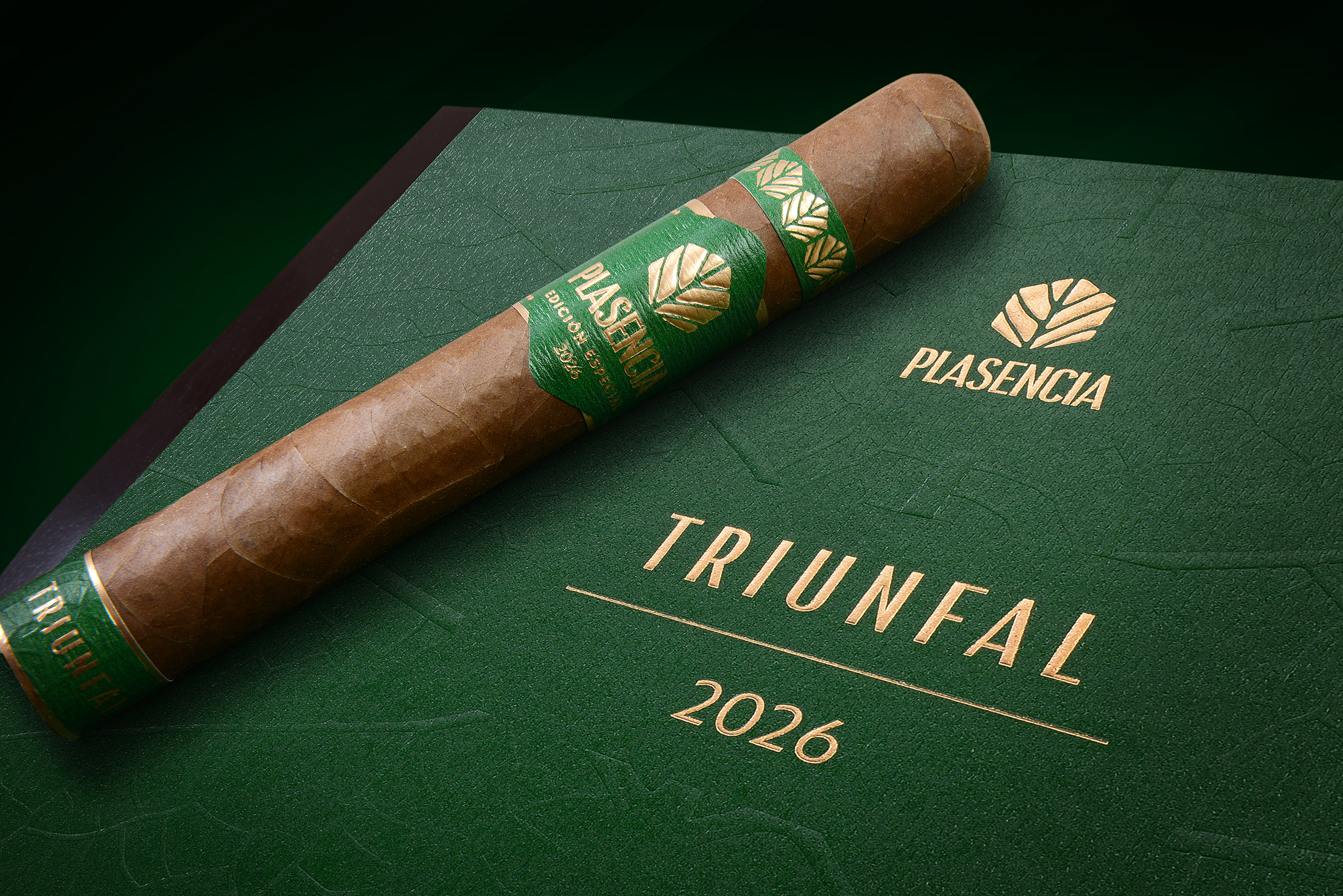 Plasencia Cigars branding materials and cigar boxes arranged on a wooden surface, showing the company's visual identity